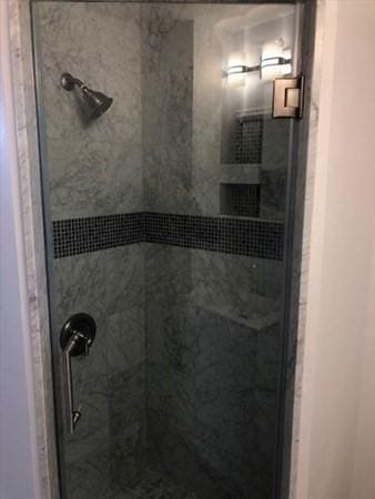 bathroom with a stall shower