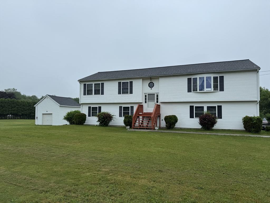 99 Spring St, Rehoboth, MA 02769 - bi-level home with a front yard