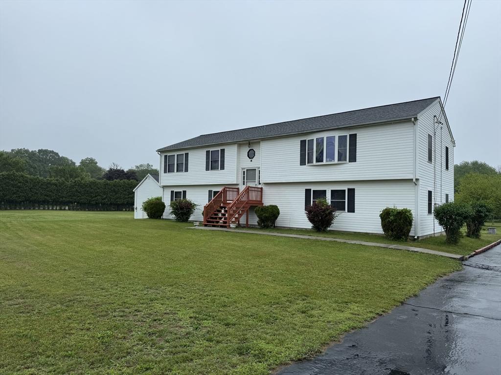 99 Spring St, Rehoboth, MA 02769 - raised ranch featuring a front yard
