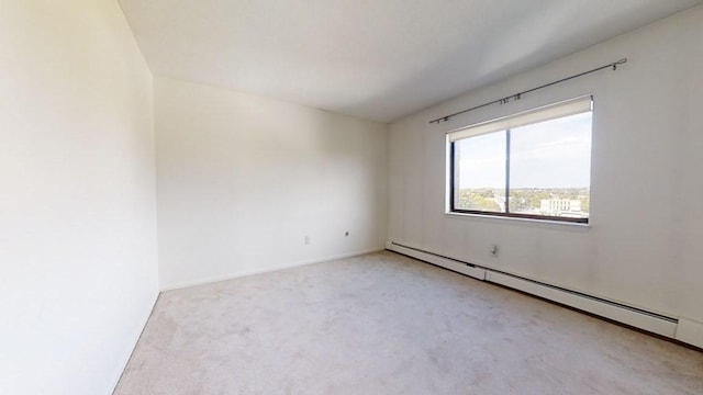 164 Galen St Unit 65, Watertown, MA 02472 - carpeted empty room featuring a baseboard heating unit and baseboards