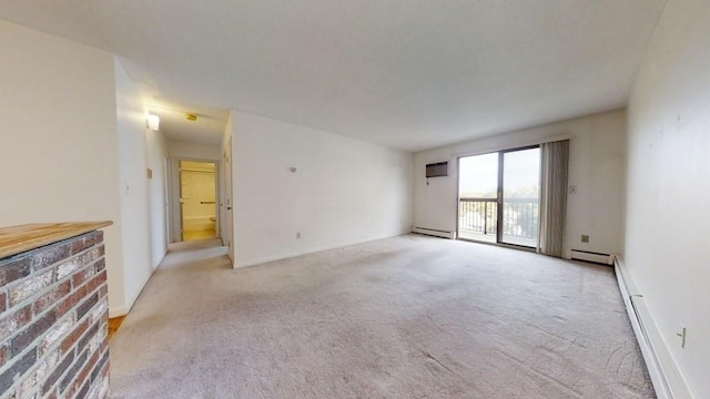 164 Galen St Unit 65, Watertown, MA 02472 - spare room featuring light colored carpet, baseboard heating, a wall mounted air conditioner, and a baseboard heating unit