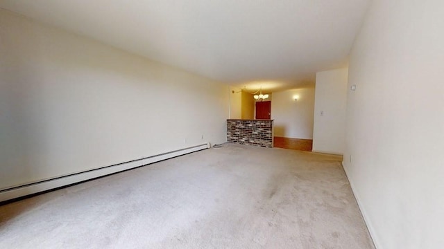 164 Galen St Unit 65, Watertown, MA 02472 - empty room featuring a chandelier, baseboard heating, and carpet