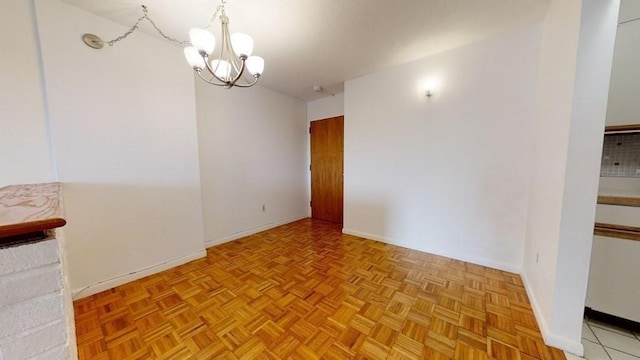 164 Galen St Unit 65, Watertown, MA 02472 - empty room with a chandelier and baseboards