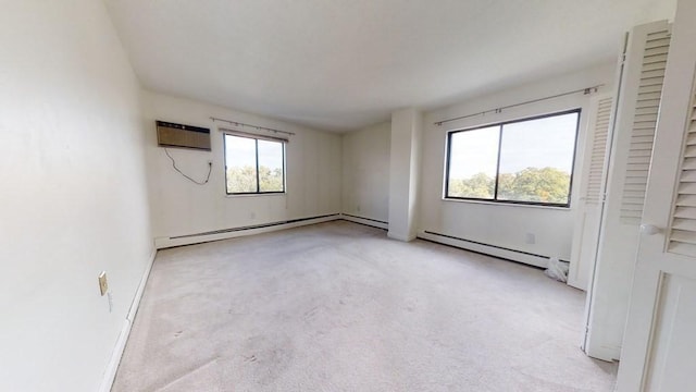 164 Galen St Unit 65, Watertown, MA 02472 - unfurnished bedroom featuring carpet flooring, a baseboard radiator, and a wall mounted air conditioner