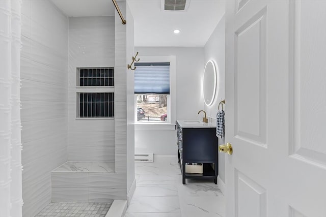 bathroom featuring a tile shower, visible vents, marble finish floor, and vanity