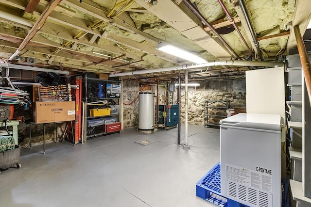 unfinished basement with gas water heater and a heating unit