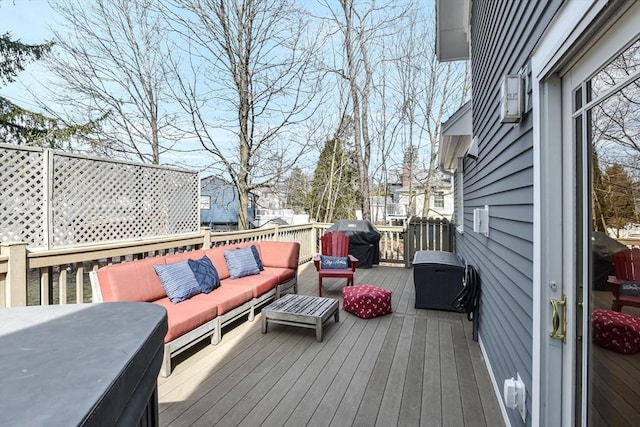 deck featuring an outdoor hangout area and area for grilling