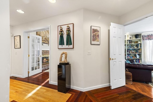 corridor featuring dark wood-type flooring