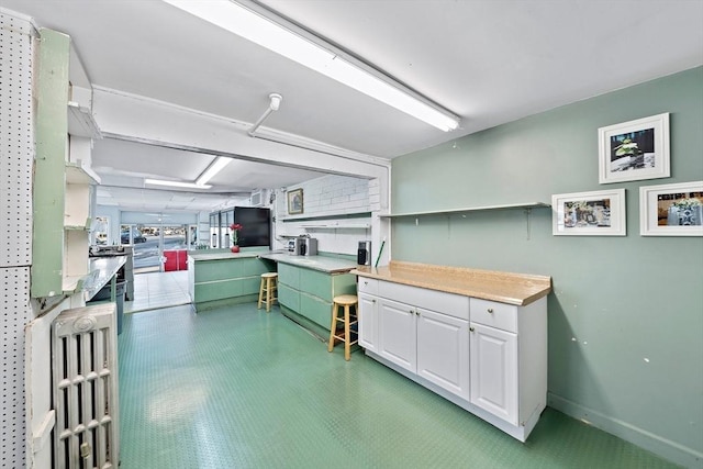 kitchen featuring white cabinets