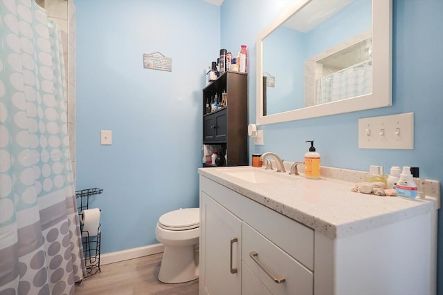 47 Leno Rd, Holland, MA 01521 - bathroom featuring toilet, vanity, wood finished floors, baseboards, and a shower with curtain