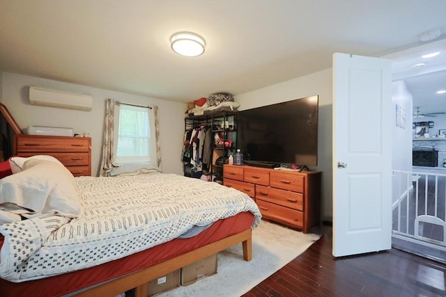 47 Leno Rd, Holland, MA 01521 - bedroom featuring a wall unit AC and dark wood-type flooring