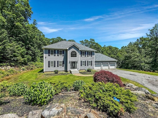 15 Stone Fence Dr, Derry, NH 03038 - colonial-style house featuring a front lawn, entry steps, and driveway