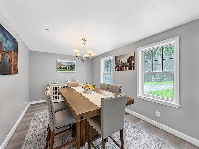 15 Stone Fence Dr, Derry, NH 03038 - dining area with healthy amount of natural light, a chandelier, and light wood-style floors