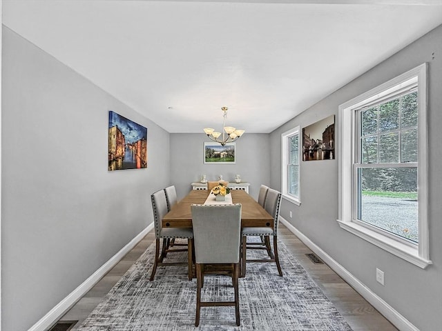 15 Stone Fence Dr, Derry, NH 03038 - dining space with a chandelier and wood finished floors