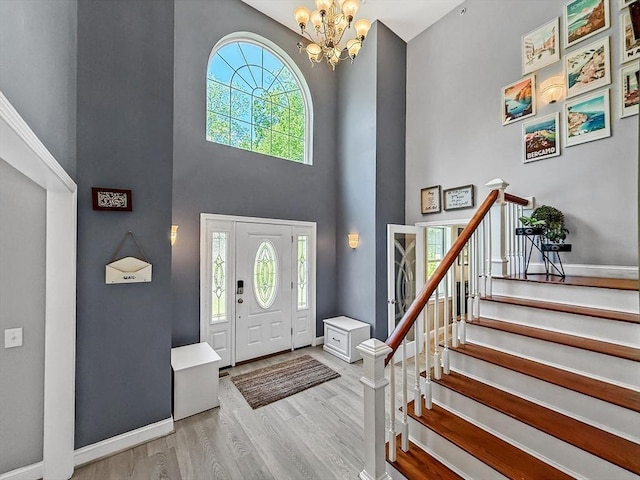 15 Stone Fence Dr, Derry, NH 03038 - foyer with a towering ceiling, wood finished floors, a chandelier, and stairway