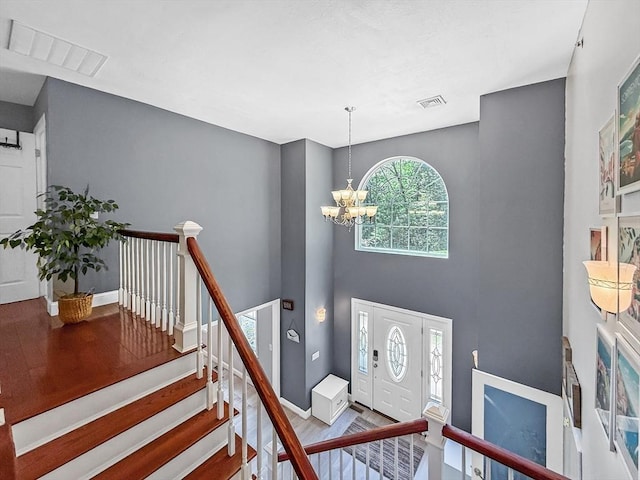 15 Stone Fence Dr, Derry, NH 03038 - entryway featuring wood finished floors and a chandelier
