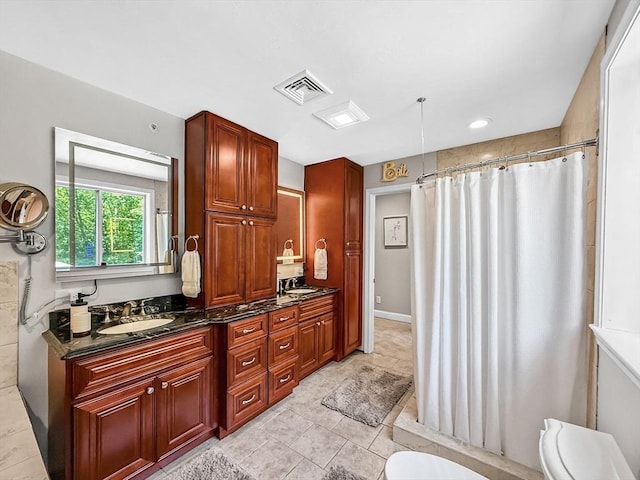 15 Stone Fence Dr, Derry, NH 03038 - full bath featuring double vanity, curtained shower, and tile patterned flooring