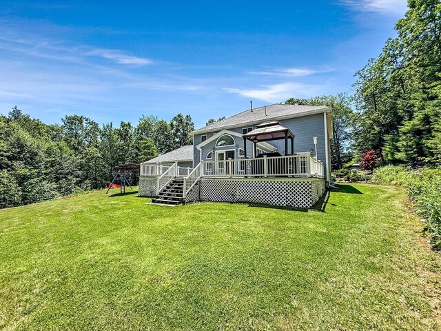 15 Stone Fence Dr, Derry, NH 03038 - rear view of house featuring a gazebo, a deck, a lawn, and roof with shingles