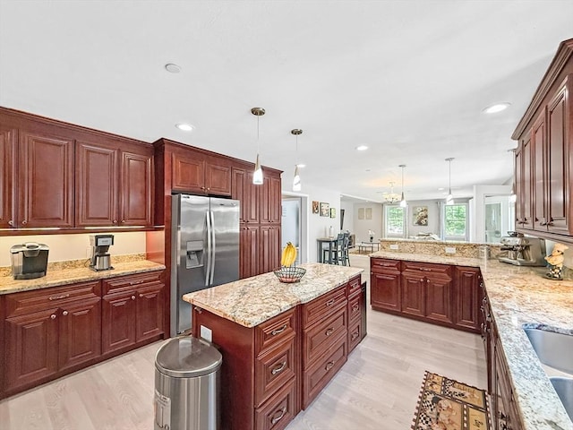 15 Stone Fence Dr, Derry, NH 03038 - kitchen featuring stainless steel fridge with ice dispenser, light wood finished floors, decorative light fixtures, recessed lighting, and a peninsula