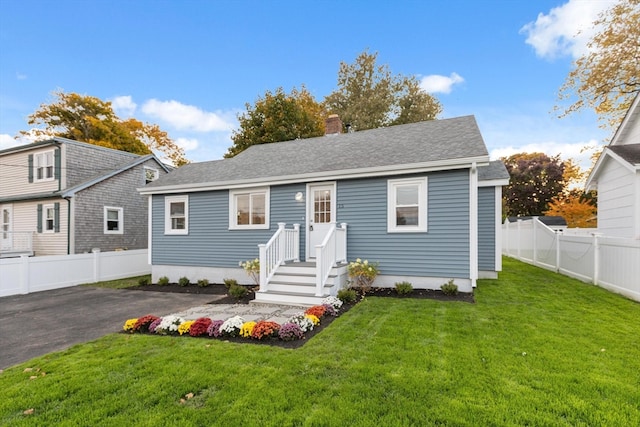 view of front of home with a front yard