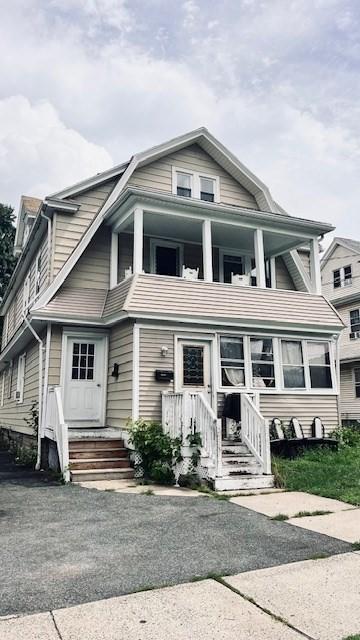 view of front of home with a balcony