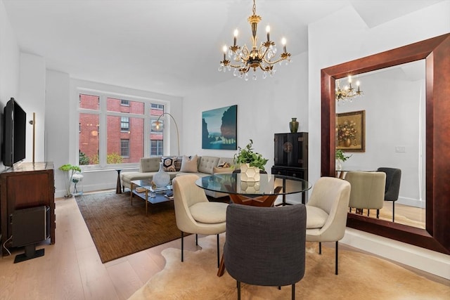 100 Lovejoy Wharf Unit 5N, Boston, MA 02114 - interior space with an inviting chandelier, baseboards, and wood finished floors