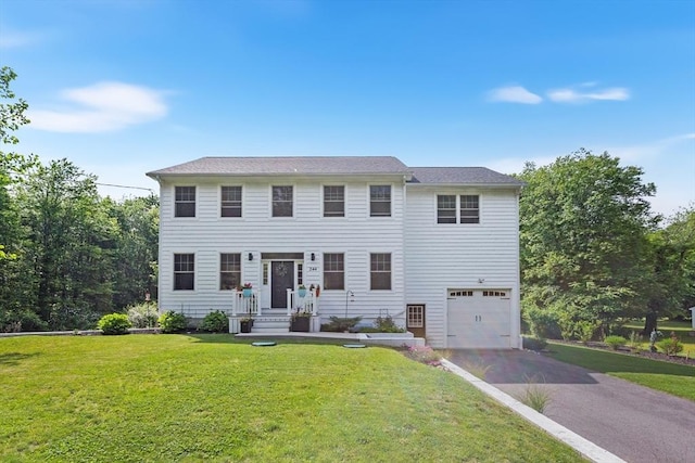 244 Prospect St, Easton, MA 02375 - colonial house with asphalt driveway, an attached garage, and a front lawn