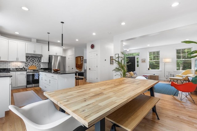 244 Prospect St, Easton, MA 02375 - dining area with light wood finished floors and recessed lighting