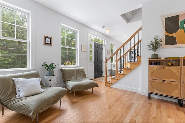 244 Prospect St, Easton, MA 02375 - entrance foyer with light wood-style flooring and stairs