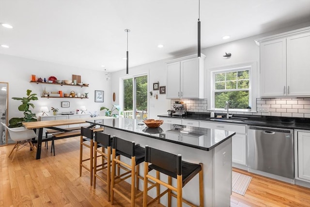 244 Prospect St, Easton, MA 02375 - kitchen with dishwasher, plenty of natural light, backsplash, a kitchen bar, and recessed lighting