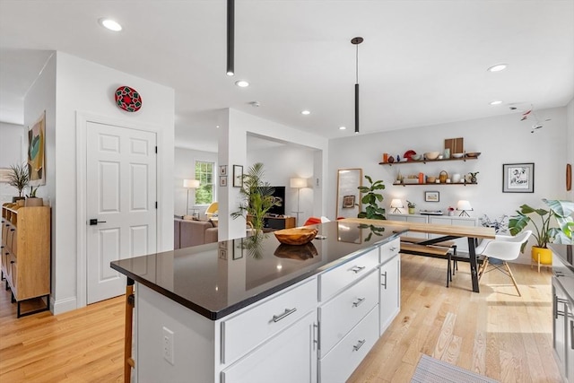 244 Prospect St, Easton, MA 02375 - kitchen with light wood-style flooring, white cabinetry, dark countertops, a kitchen island, and recessed lighting