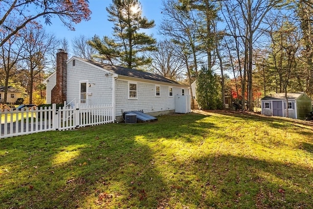 exterior space with a storage unit and a lawn