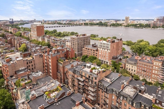 birds eye view of property featuring a city view and a water view