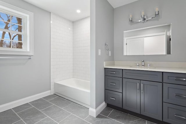 full bath featuring shower / washtub combination, vanity, and baseboards