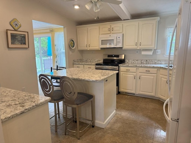 21 Deer Run, Brookfield, MA 01506 - kitchen with white appliances, white cabinets, a kitchen bar, ornamental molding, and a ceiling fan