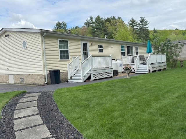 21 Deer Run, Brookfield, MA 01506 - back of property with crawl space, a lawn, and a deck