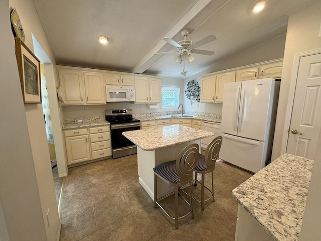 21 Deer Run, Brookfield, MA 01506 - kitchen with white appliances, a sink, a kitchen island, a breakfast bar, and light stone counters