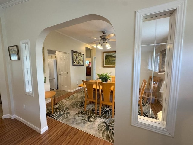 21 Deer Run, Brookfield, MA 01506 - dining room featuring arched walkways, wood finished floors, ornamental molding, baseboards, and a ceiling fan