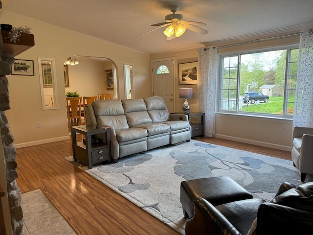 21 Deer Run, Brookfield, MA 01506 - living area with arched walkways, wood finished floors, ceiling fan, crown molding, and baseboards