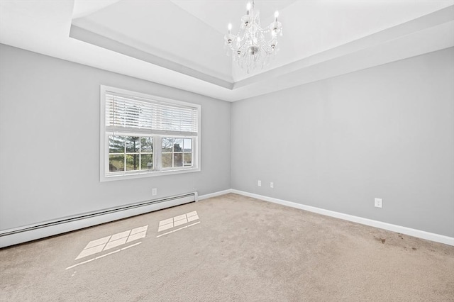 empty room featuring carpet, baseboards, baseboard heating, and a chandelier