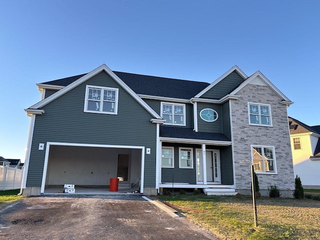 view of front of home with a garage and a front lawn