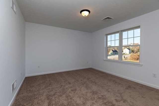 unfurnished room featuring carpet flooring