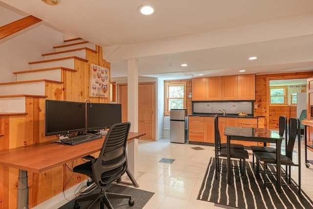 office featuring wooden walls, plenty of natural light, and recessed lighting
