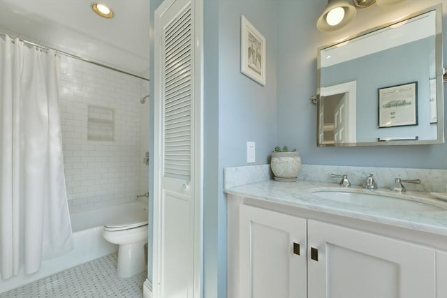 full bathroom featuring toilet, shower / tub combo, and vanity