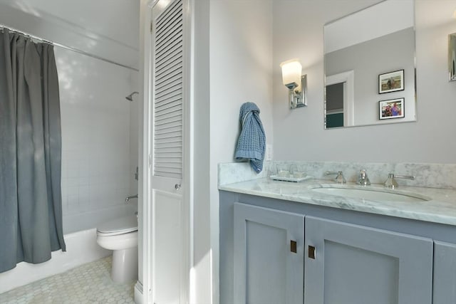 full bath with a closet, toilet, shower / tub combo, vanity, and tile patterned flooring