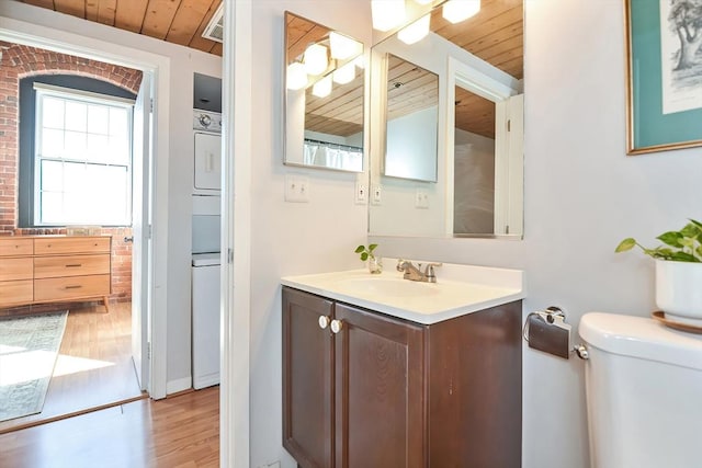 bathroom featuring toilet, wooden ceiling, vanity, and wood finished floors