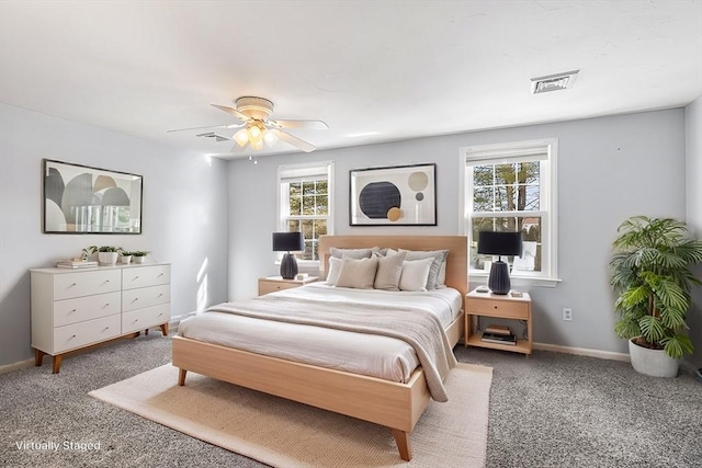 bedroom with multiple windows and ceiling fan