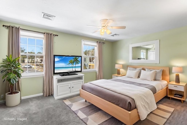 bedroom with ceiling fan and carpet