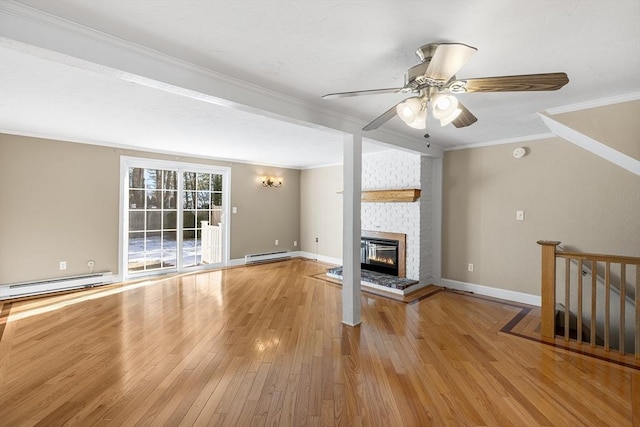 unfurnished living room with ornamental molding, a brick fireplace, light wood-type flooring, and baseboard heating