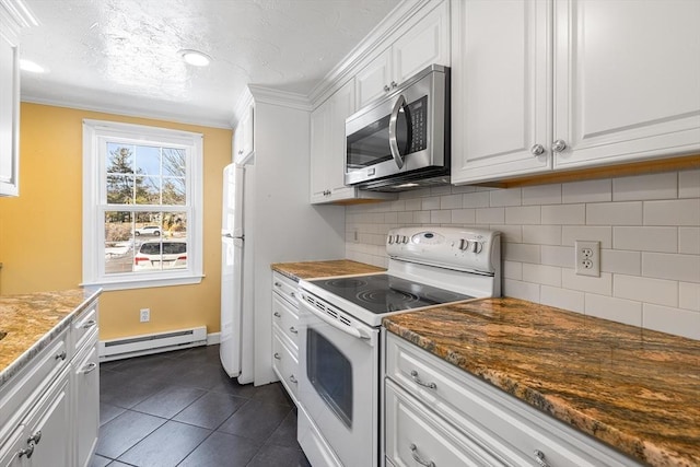 kitchen with crown molding, dark stone countertops, a baseboard heating unit, white appliances, and white cabinets